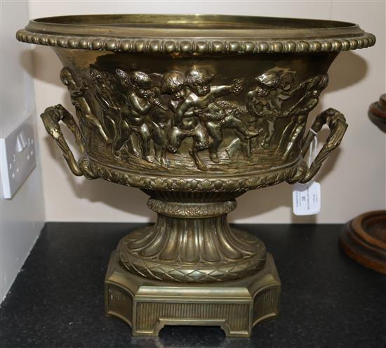 A large gilt bronze two handled oval vase, moulded with continuous bacchanalian scene, height 14.75in.